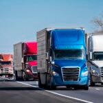 Long Convoy of Trucks on Interstate Highway